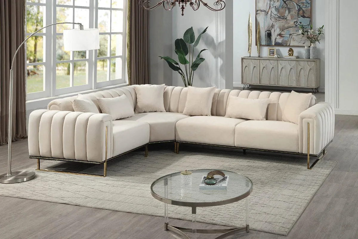 A large L-shaped sectional sofa with channel-tufted backrests and a low metal base.
