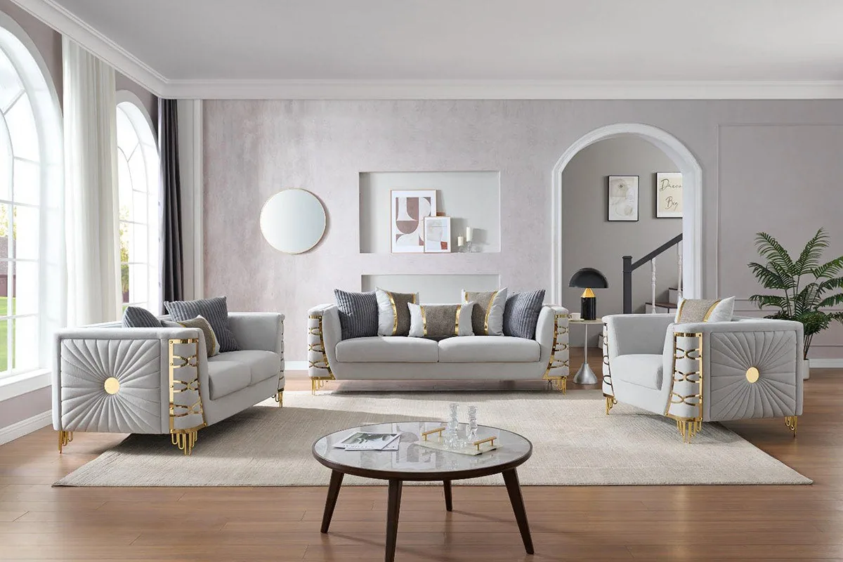 A light neutral sofa set with sunburst-patterned side panels and slim gold-finished legs.