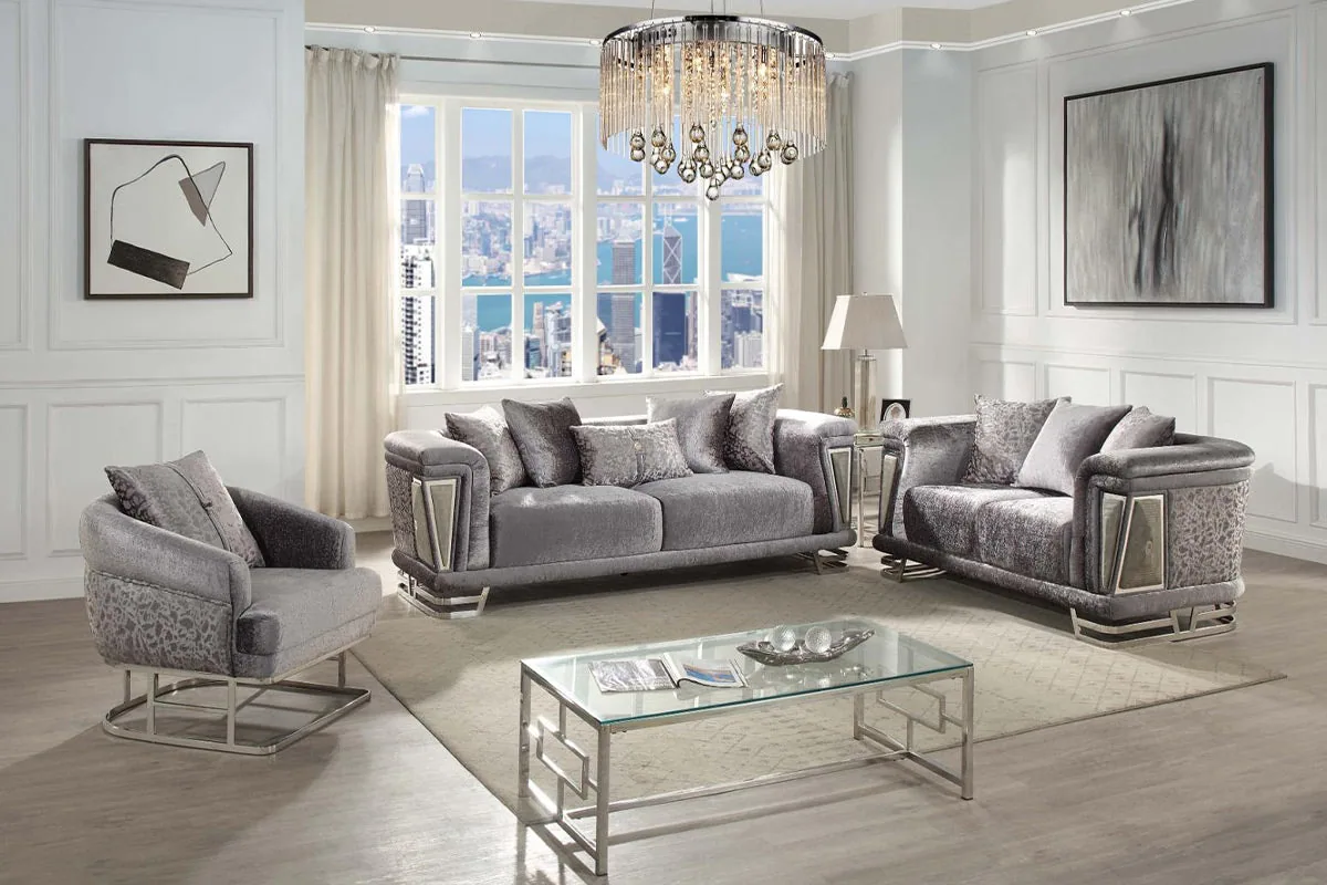 A neutral-toned sofa set with softly curved arms and slim metal legs.