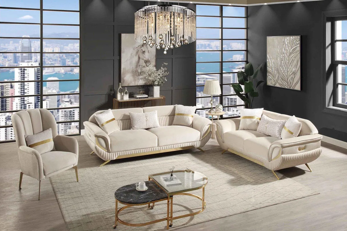 A curved sofa set with sculpted padded arms and gold accents along the frame.